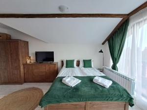 Postel nebo postele na pokoji v ubytování Premium StudioApartment in Borovets Gardens + 25 fotografií