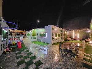 a play area with a play set and a playground at شاليهات درة نجد in Al Muraysīyah