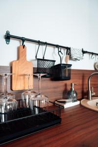 a kitchen counter with wine glasses and a sink at CIRCLE OF 2 in Belgrade