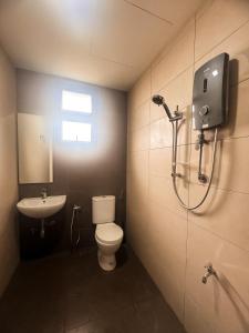 a bathroom with a toilet and a sink at CT View Homestay by Ifaizal, Presint 15 Putrajaya in Putrajaya