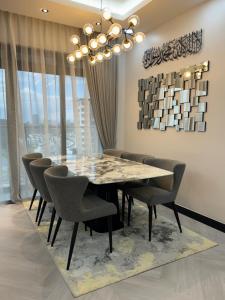 a dining room with a table and chairs at CT View Homestay by Ifaizal, Presint 15 Putrajaya in Putrajaya