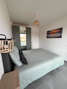 a bedroom with a large bed in a room at Menton centre, jardin Bioves, casino in Menton