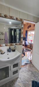 a bathroom with a sink and a mirror at Habitación con vista al mar in Puerto Montt