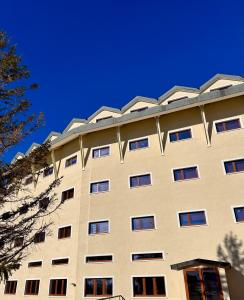 a tall building with windows on top of it at Brown bear home in Roccaraso