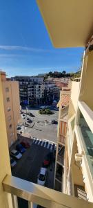 a view from a balcony of a parking lot at Menton centre, jardin Bioves, casino in Menton