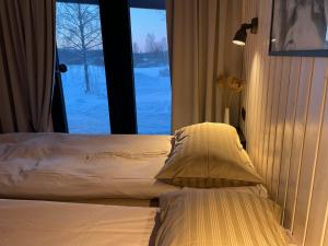 Postel nebo postele na pokoji v ubytování Tondikaku Holiday Home