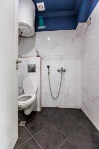 a bathroom with a toilet and a shower at B2 Delux Studio Saffron in Plovdiv