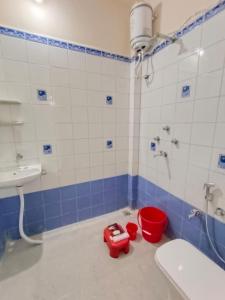 a bathroom with a sink and a toilet and a shower at Shree Avantika home stay in Ujjain