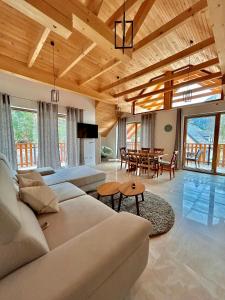 a living room with a couch and a table at ALPS Apartments in Kranjska Gora