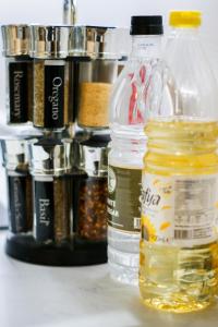 a group of bottles sitting on a table with spices at The Madison Apartment by GGE, Hemel Hempstead Town Centre, Contractors Welcome, Sleeps 6 in Hemel Hempstead