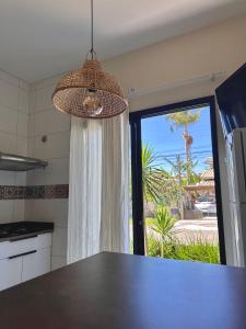 Η κουζίνα ή μικρή κουζίνα στο Apartamento na praia Garopaba San Pietro Sc Loft 104