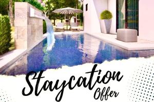 an image of a swimming pool with the words vacation advisor at Staycation @ Sandari Batulao in Tagaytay