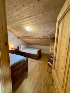 Ліжко або ліжка в номері Bormio House con vista pista Stelvio