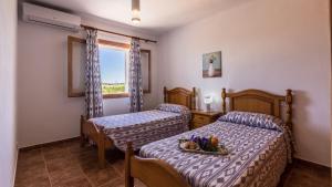 A bed or beds in a room at Villa Son Fanals