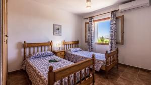 A bed or beds in a room at Villa Son Fanals