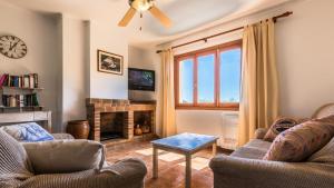 A television and/or entertainment centre at Villa Son Fanals