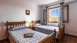 A bed or beds in a room at Villa Son Fanals
