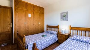 A bed or beds in a room at Villa Son Fanals