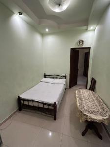 Manand Hotel客房内的一张或多张床位