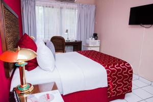 Televiisor ja/või meelelahutuskeskus majutusasutuses Aparthotel Guijarros