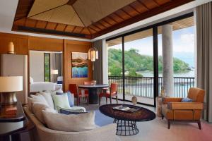 a living room with a view of the water at TA’AKTANA, a Luxury Collection Resort & Spa, Labuan Bajo in Labuan Bajo