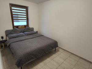 Postel nebo postele na pokoji v ubytování Apartmán na Karlíčku