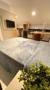 Ein Bett oder Betten in einem Zimmer der Unterkunft Loft do Vale