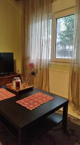 TV a/nebo společenská místnost v ubytování Virginia Apartment