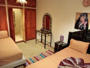 Uma cama ou camas num quarto em Riad Salma Restaurant Spa