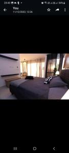 a picture of a bedroom with a large bed at Rose Beach Chalet in Aqaba