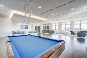 a pool table in the middle of a room at Luxury Living at Crystal City's Condo in Arlington