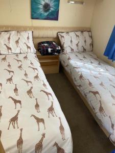Ένα ή περισσότερα κρεβάτια σε δωμάτιο στο Sunkist holiday home from home