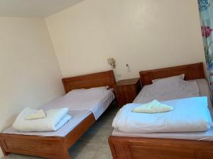 En eller flere senge i et værelse på Dao homestay Vũ Linh
