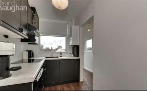 a kitchen with white walls and a large window at Central Hove Quiet Top Floor Flat with Terrace in Brighton & Hove