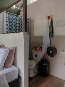 a small bathroom with a toilet and a shower at Flora Glamping de Abuela in Fortuna