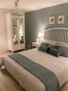 Postel nebo postele na pokoji v ubytování B&B Nathalie