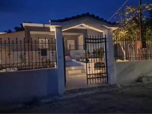 a house with a gate in front of it at Karmen House in Salamina