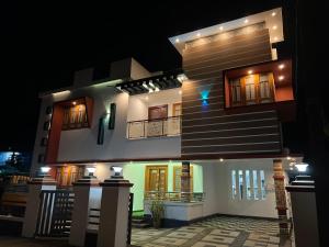 a model of a house at night at Happy Villa Homestay in Chelakara