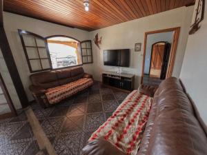 TV a/nebo společenská místnost v ubytování Casa espaçosa em Matinhos