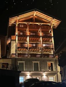 a tall building with a balcony on the side of it at MB26 in Courmayeur