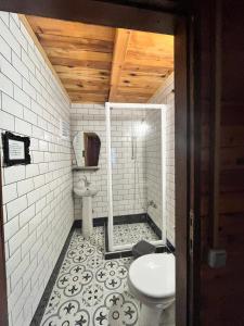 a bathroom with a toilet and a sink at Kızılbük Ahşap Evleri in Datca