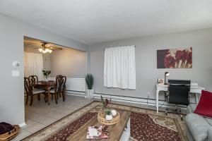a living room with a couch and a table at 2 Bedroom Oasis 5 Mins to Mayo Clinic in Rochester