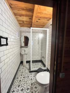 a bathroom with a toilet and a sink at Kızılbük Ahşap Evleri in Datca