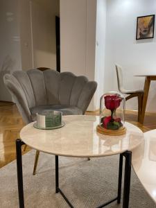 a coffee table in a living room with a couch at Luxury Getaway Apartment in Skopje