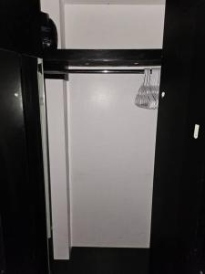 a glass door of a refrigerator with a utensil at Hotel-Studio @ The Mansfield Midtown in New York