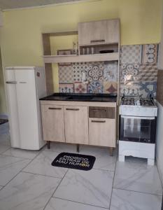 Kuchyň nebo kuchyňský kout v ubytování Santos house casa com dois quartos + 2 fotografie