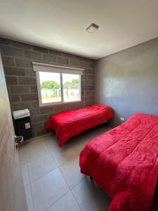 En eller flere senge i et værelse på Casa en el rio
