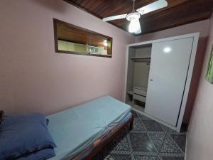 Postel nebo postele na pokoji v ubytování Casa espaçosa em Matinhos