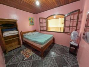 Postel nebo postele na pokoji v ubytování Casa espaçosa em Matinhos