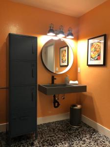 a bathroom with a sink and a mirror at Petaluma Warehouse Lofts, Unit B in Petaluma